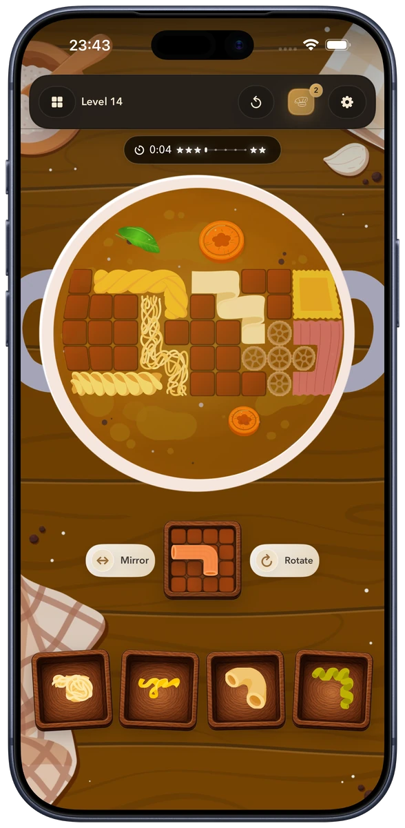 Fresh Start level 14 on iPhone: pasta pieces, a partly filled board and rotate and mirror controls.
